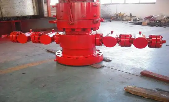 What is the difference between a wellhead and a Christmas tree?