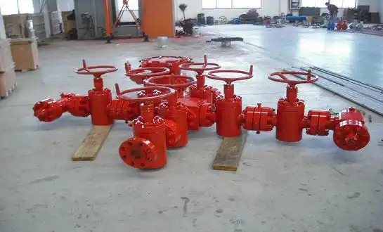 What is the difference between a wellhead and a tubing head?